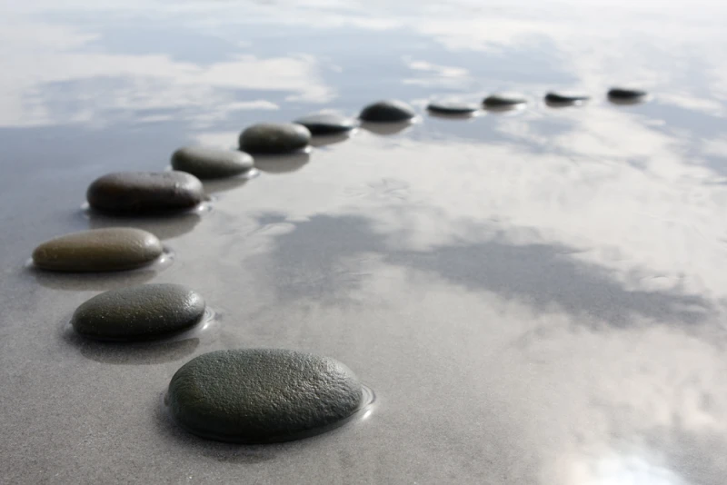 A row of stones signify a phased approach, or one step at a time