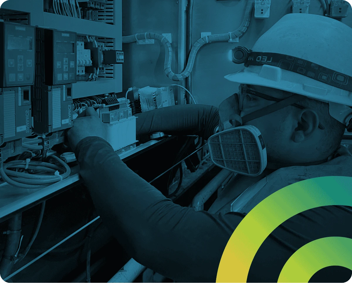 Industrial technician with safety gear accessing control systems—highlighting the risks of privileged access beyond IT.